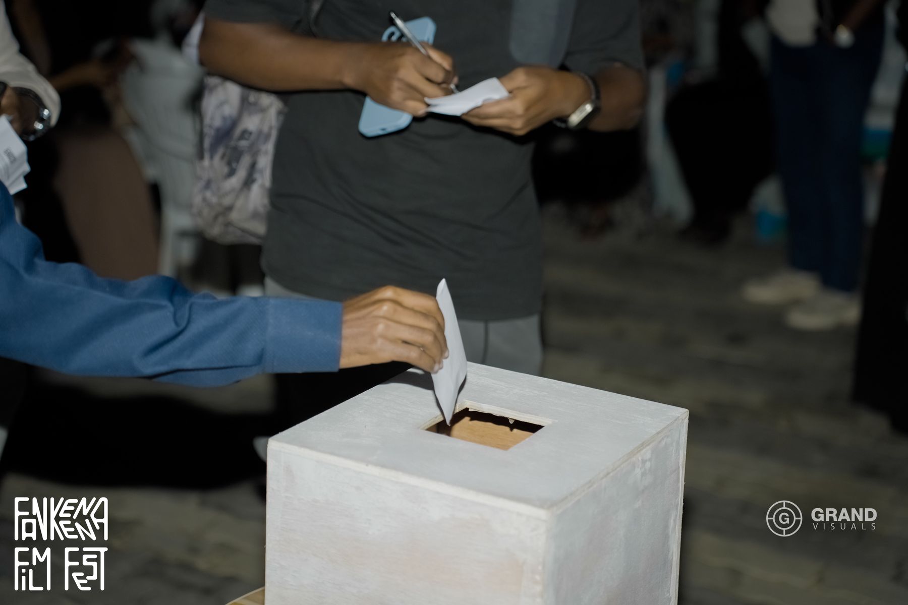 A visitor drops a vote into the ballot box